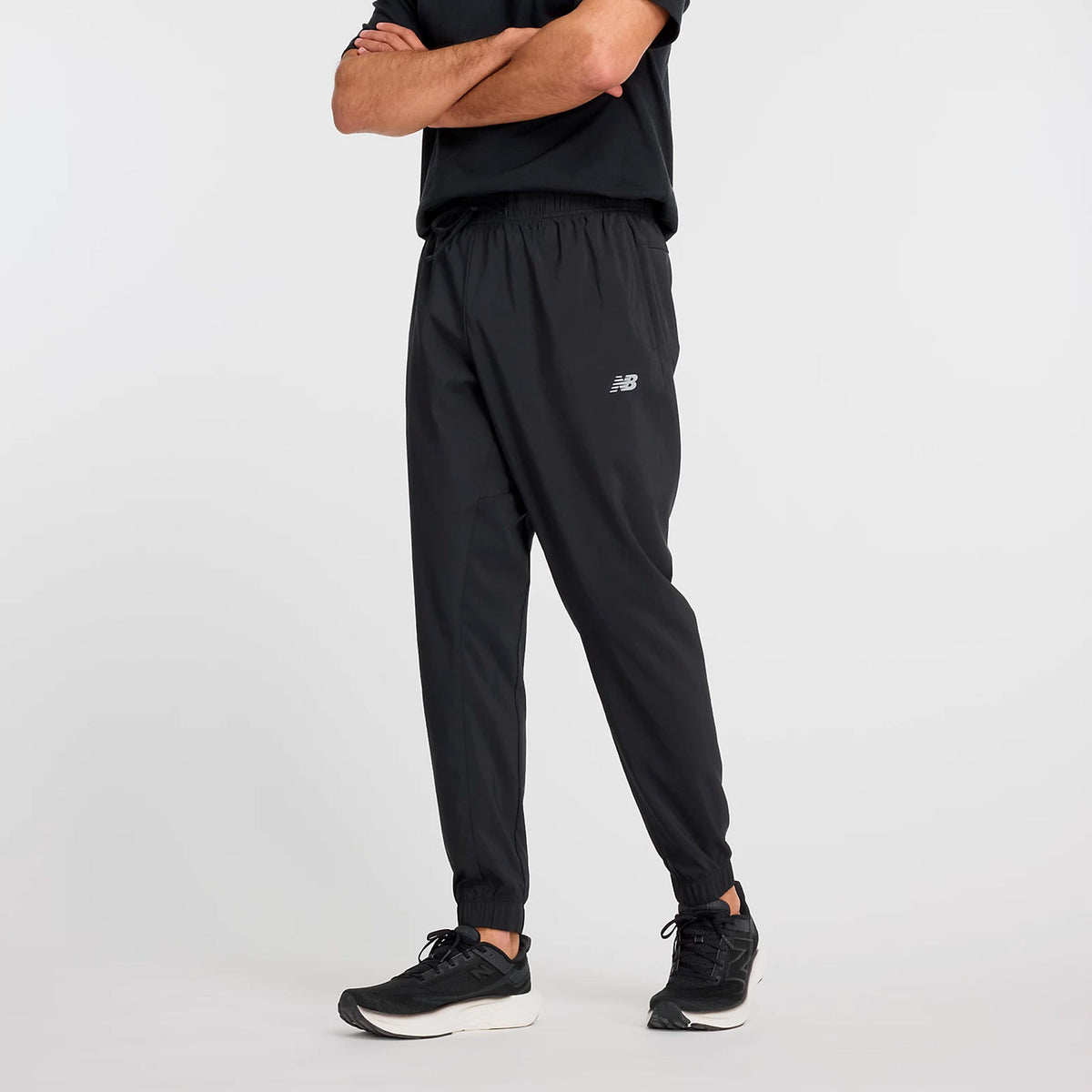 New Balance Essentials Woven Tréninkové kalhoty Muži - černá